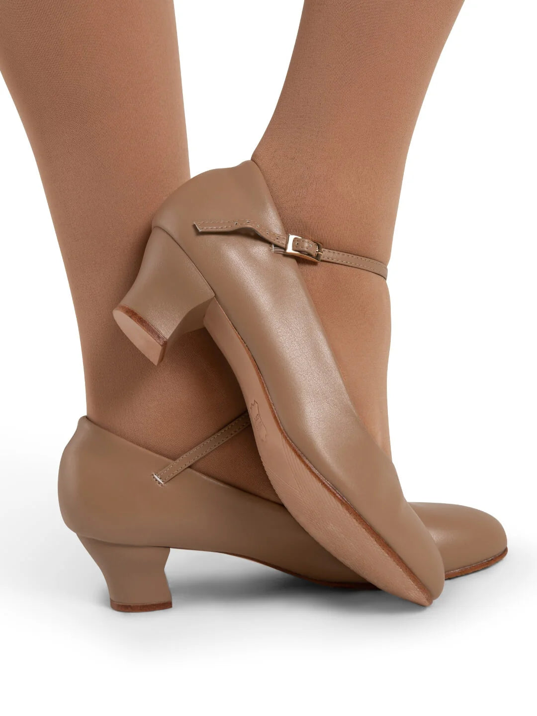 Mia Jr 1.5″ caramel character shoe featuring PU microfiber upper, sculpted heel, adjustable strap, and leather sole shown on model