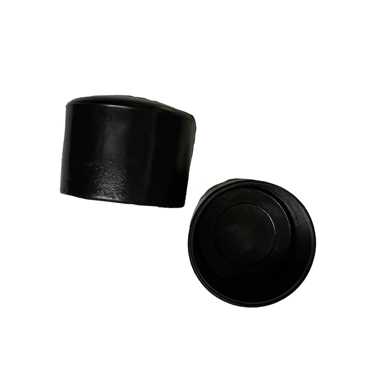 White and black Vivace vinyl pole cap shown both outside and inside views—smooth exterior cap and hollow interior lip to securely grip 1″ pole shafts.