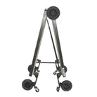 Folded Jarvis Mobile Percussion Platform standing upright like an A-frame; black powder‑coated steel frame with four 8″ swivel casters and two fixed wheels—compact for storage and transport